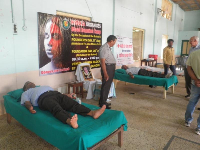 Fr. P.J.James s.j. and Mr. Cyprian Surin donating blood;