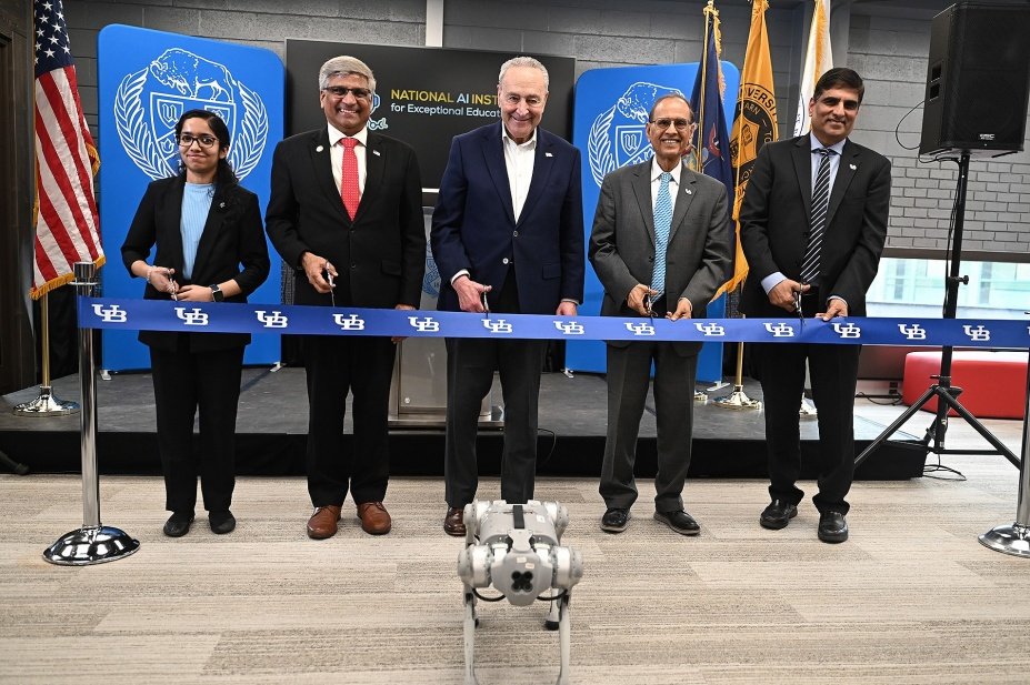 Preparing to cut the ribbon to open the National AI Institute for Exceptional Education are (from left) Sahana Rangasrinivasan, a computer science and engineering PhD candidate; NSF Director Sethuraman Panchanathan; U.S. Senate Majority Leader Chuck Schumer; President Satish K. Tripathi and Venu Govindaraju, vice president for research and economic development, and principal investigator of the AI institute. Photo: Nancy J. Parisi